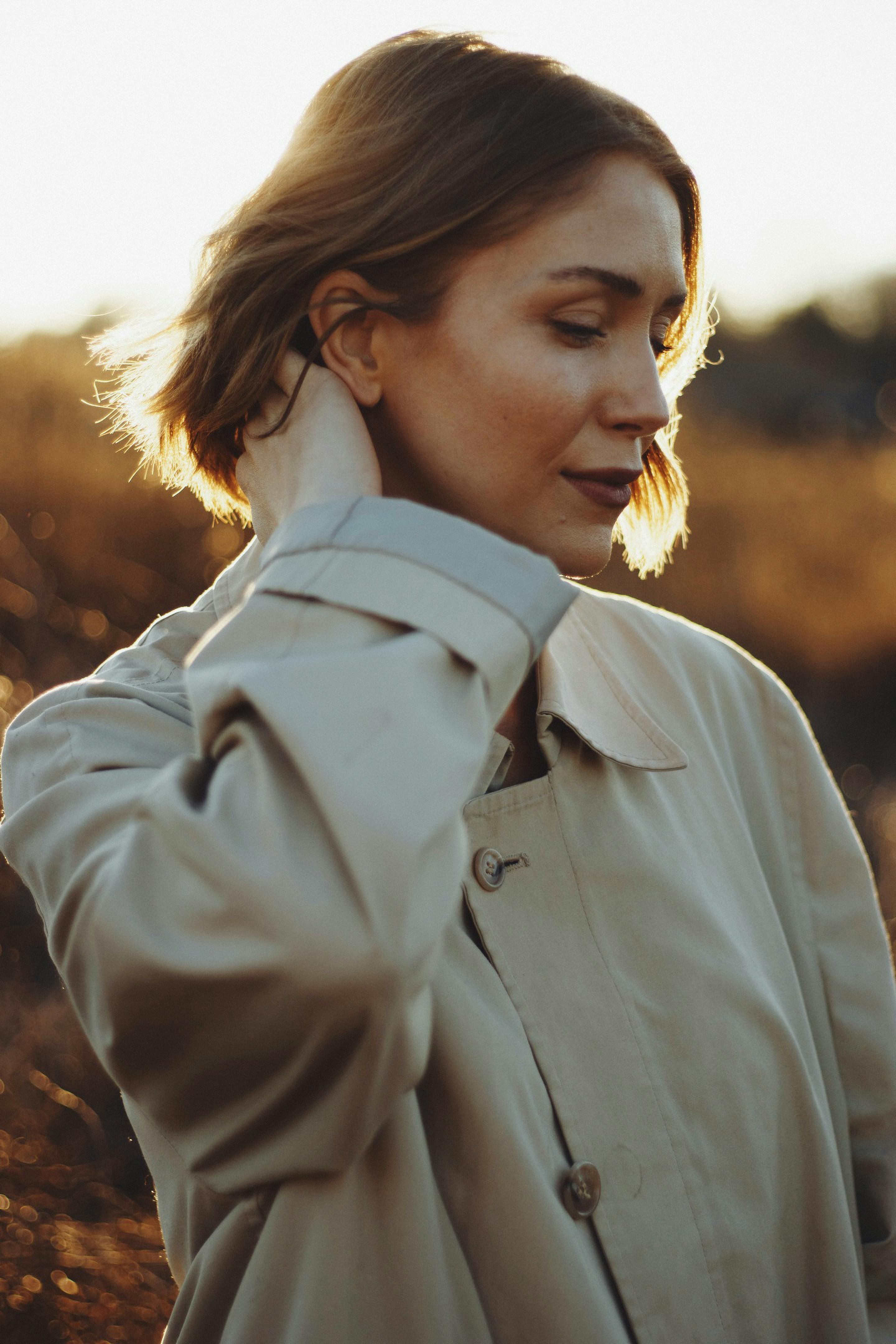 A serene portrait captured during golden hour in Brevard, NC, showcasing natural beauty and warm tones.