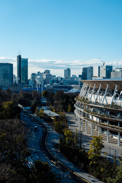 Free A view of the Tokyo city skyline featuring modern architecture and clear blue skies. Stock Photo