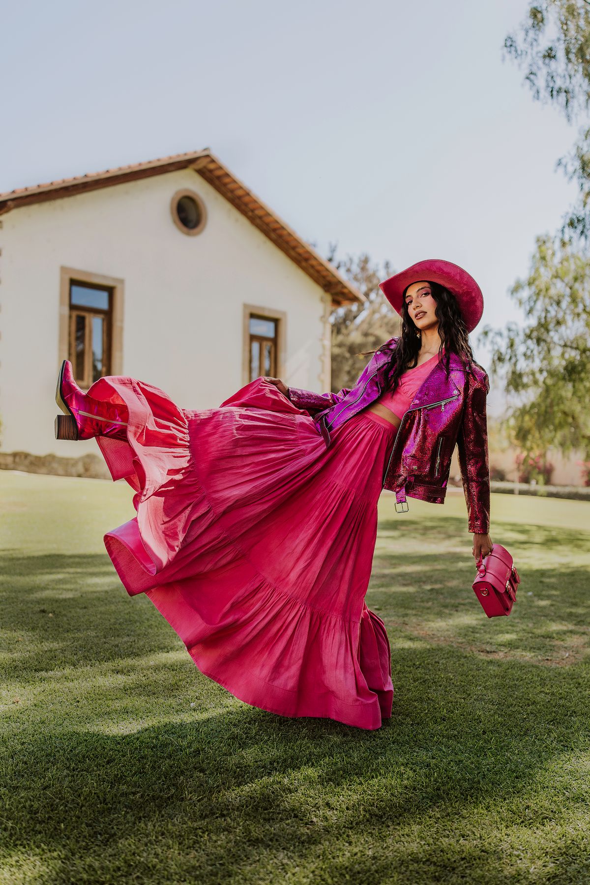 A woman in a vibrant pink dress — the new chic