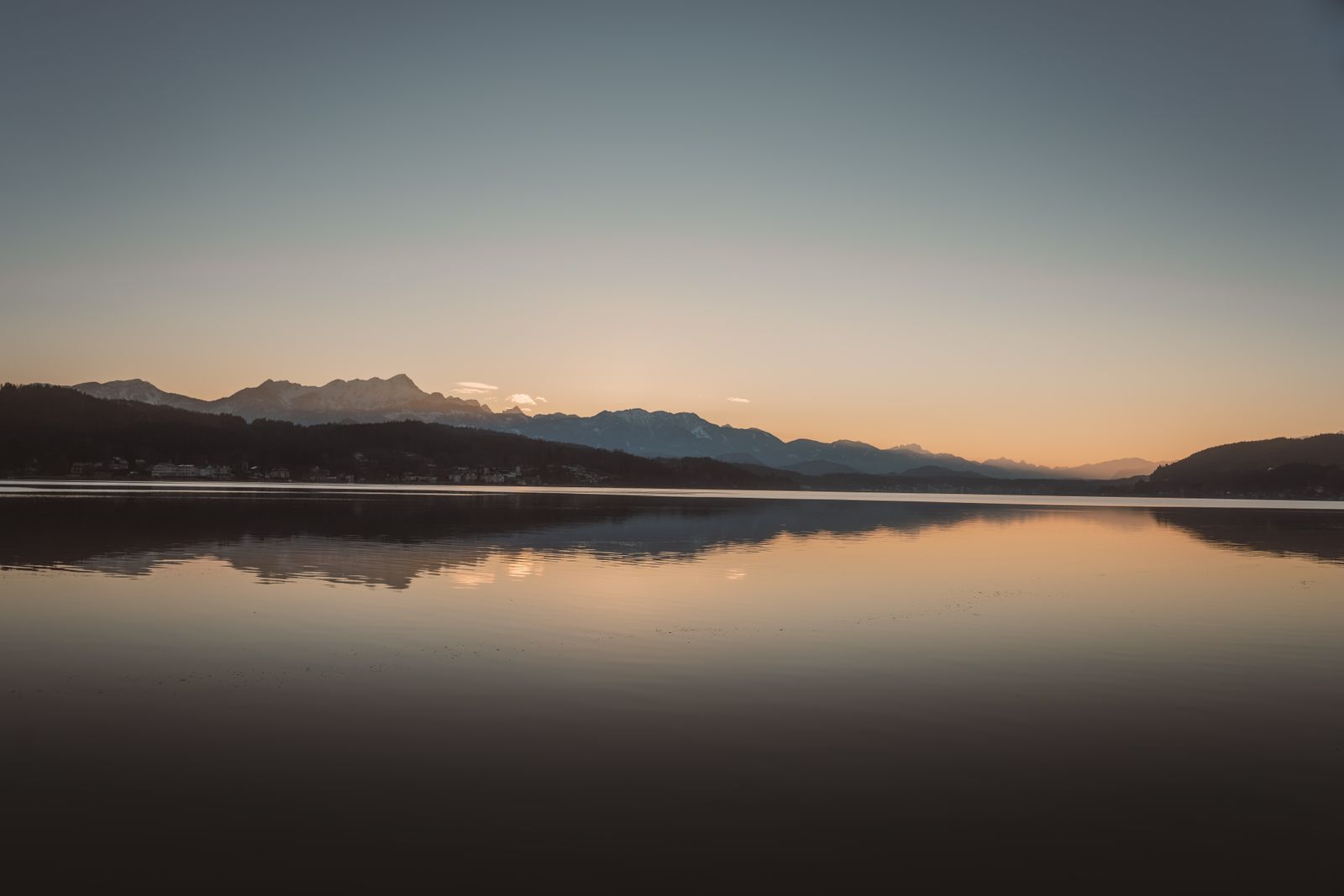 Tranquil Sunset Over Mountain Lake · Free Stock Photo