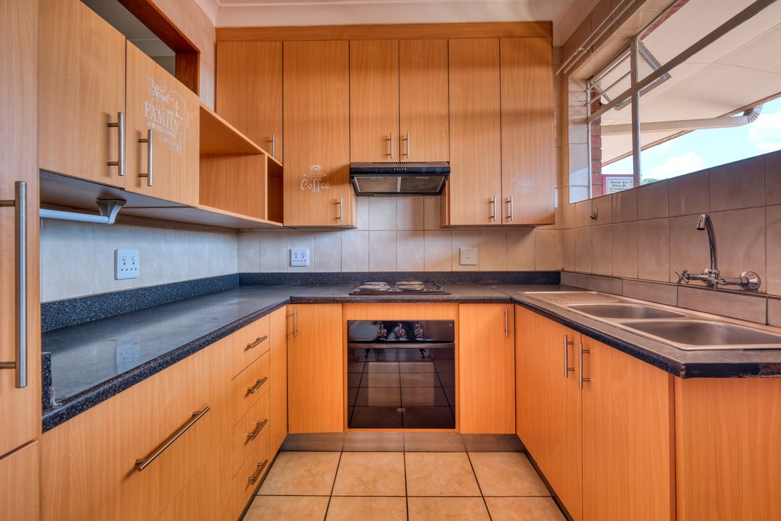 Tiny kitchen with smart design Modern kitchen with wooden cabinets and smart design