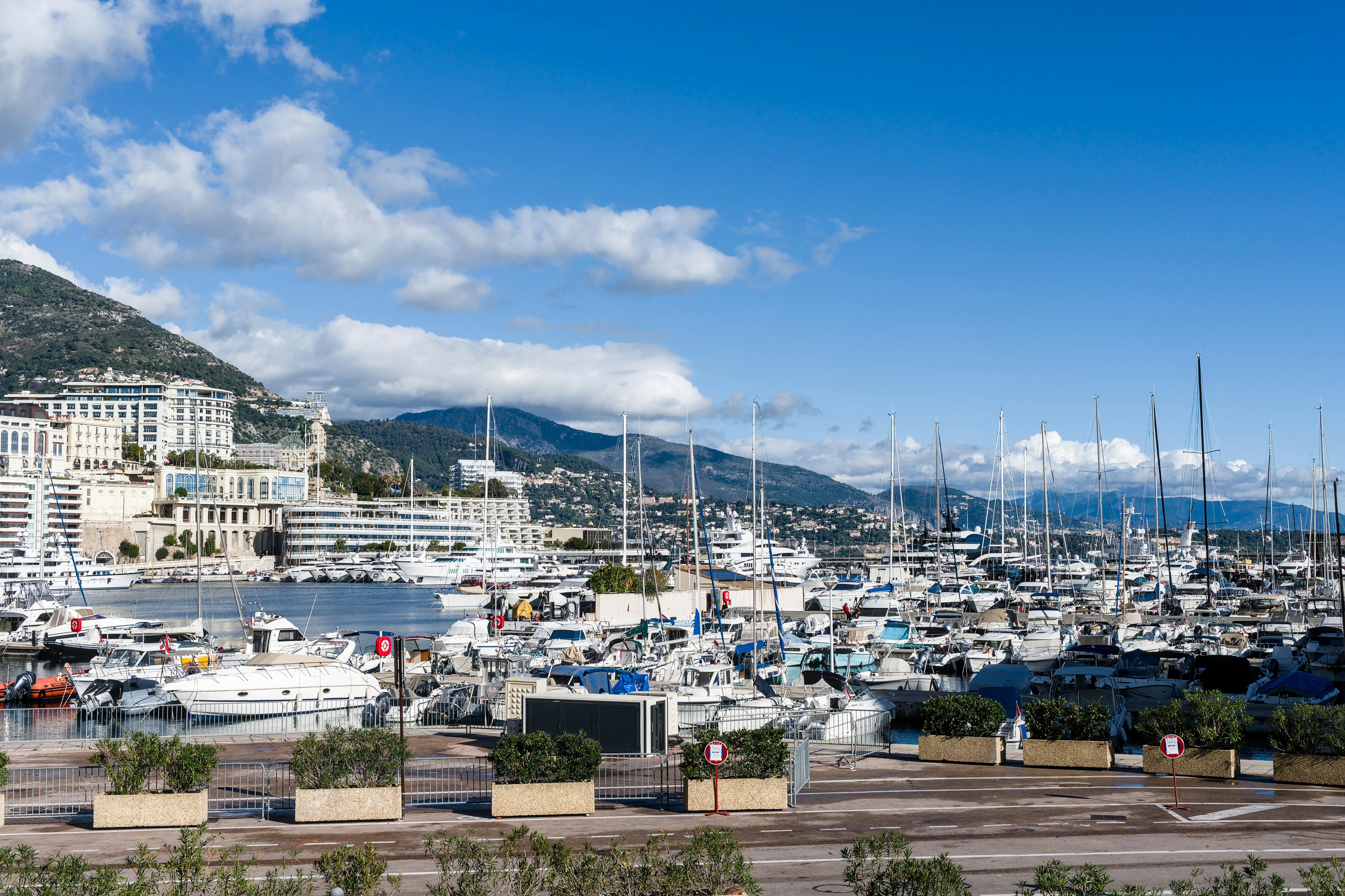 hidden gems riviera maya private tour operators - Explore the stunning yachts and scenic mountains at Monte Carlo Harbor in Monaco.