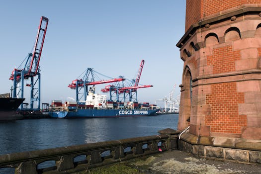 A vibrant view of container ships and cranes at Hamburg Port, Germany. Perfect for commerce and trade visuals.