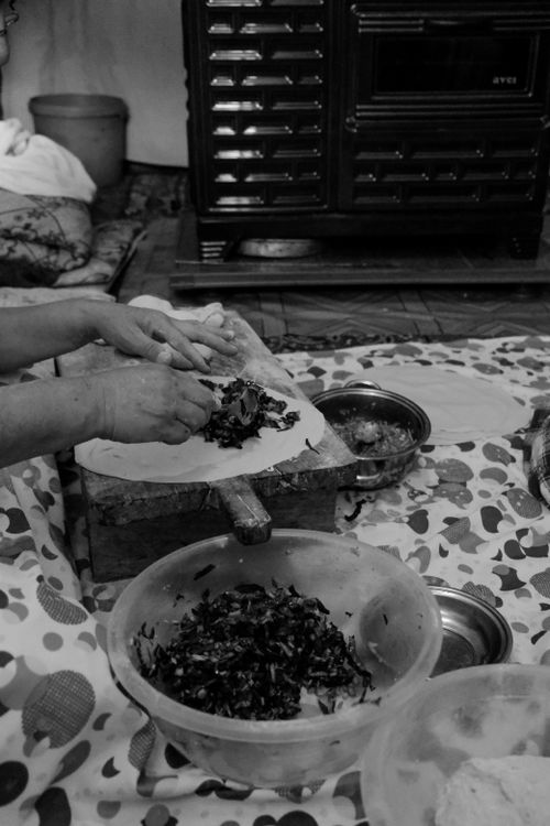 Free Black and white image of hands preparing food, evoking a rustic and traditional cooking vibe. Stock Photo