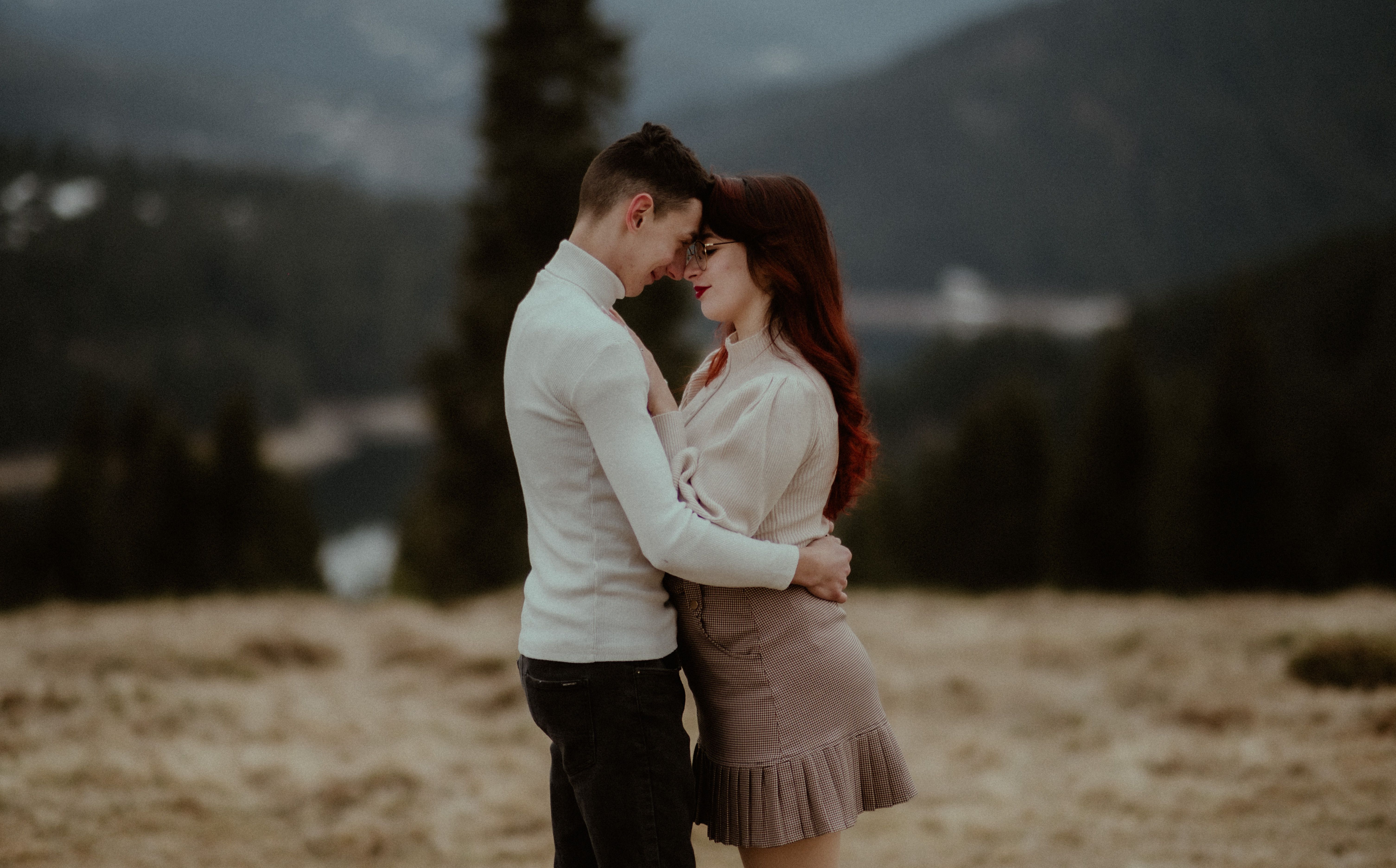 A couple shares a romantic moment in the mountains of Beliș, Romania.
