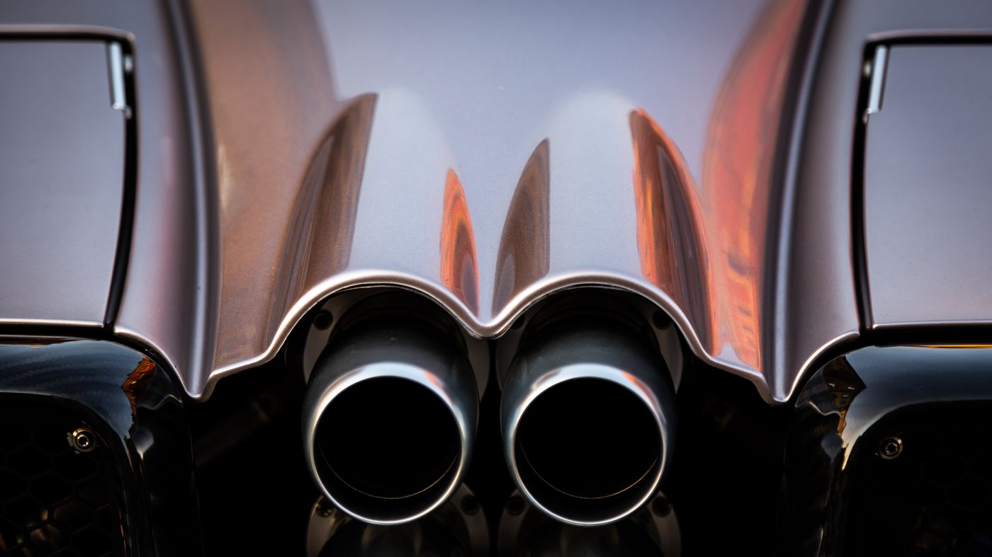 Twin performance exhaust tips on a sports car