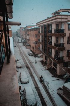 Aerial view of a snowy residential street in Istanbul, capturing a serene winter scene.