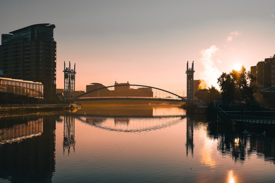 Captivating sunset view of Salford Quays in Manchester with reflections and warm tones.