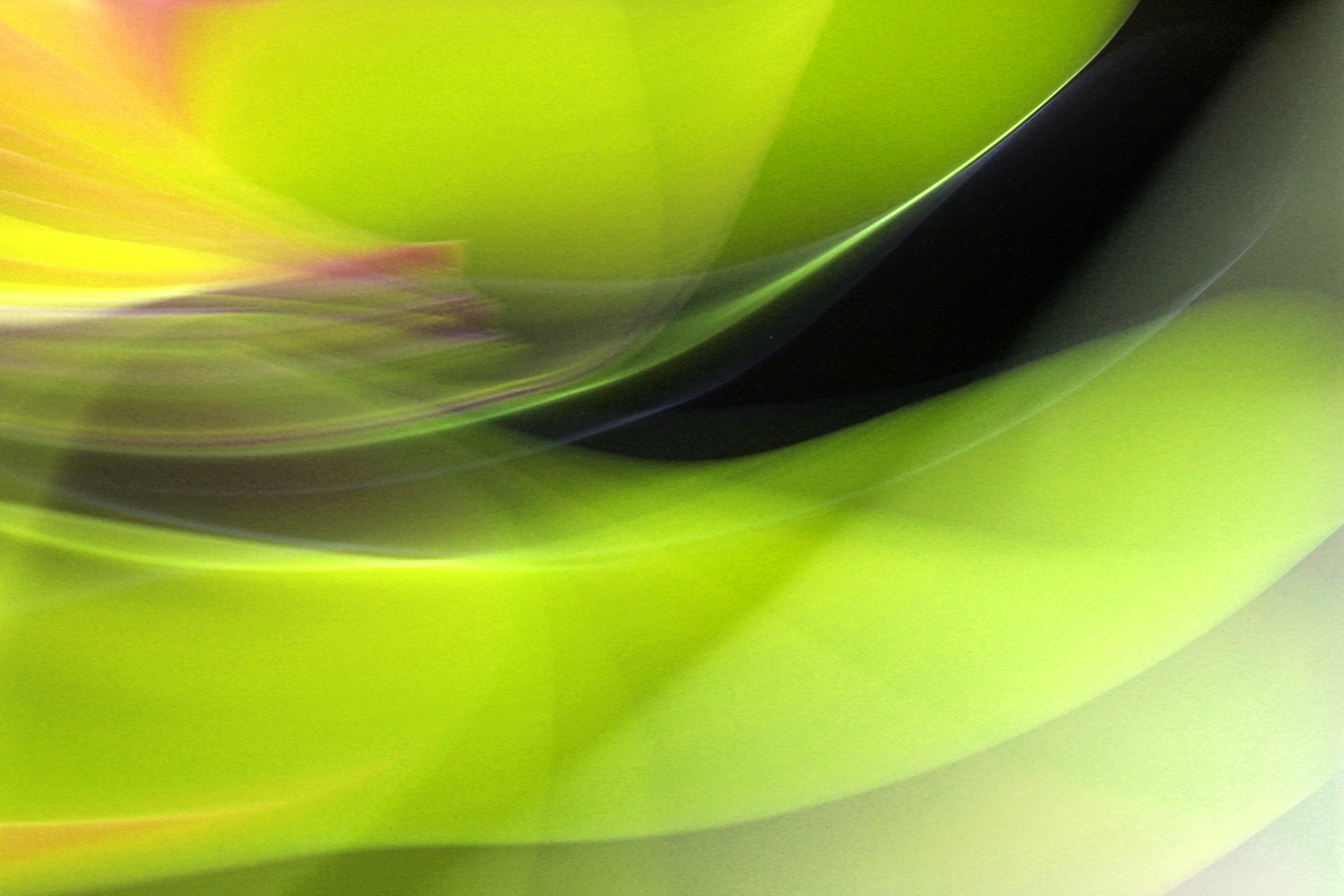 Gratis Immagine astratta dinamica con vivaci vortici verdi e gialli che creano un senso di movimento. Foto a disposizione