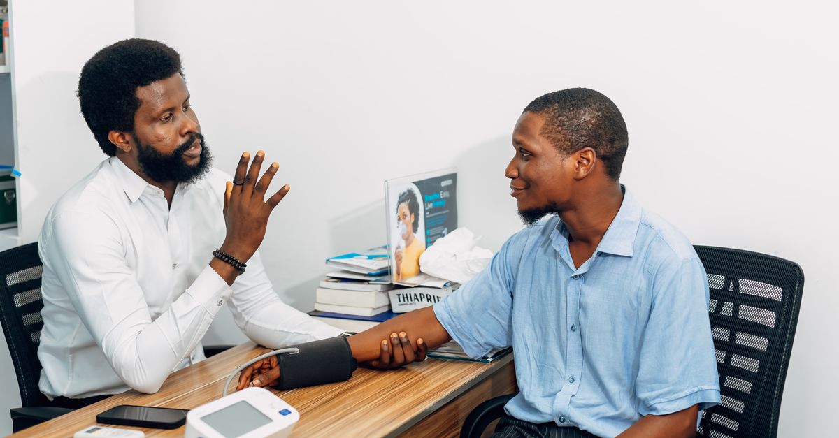 A medical professional consults with a patient during a blood pressure checkup in Lagos, Nigeria. - Evidence evidence guide for black seed oil blood pressure randomized trial