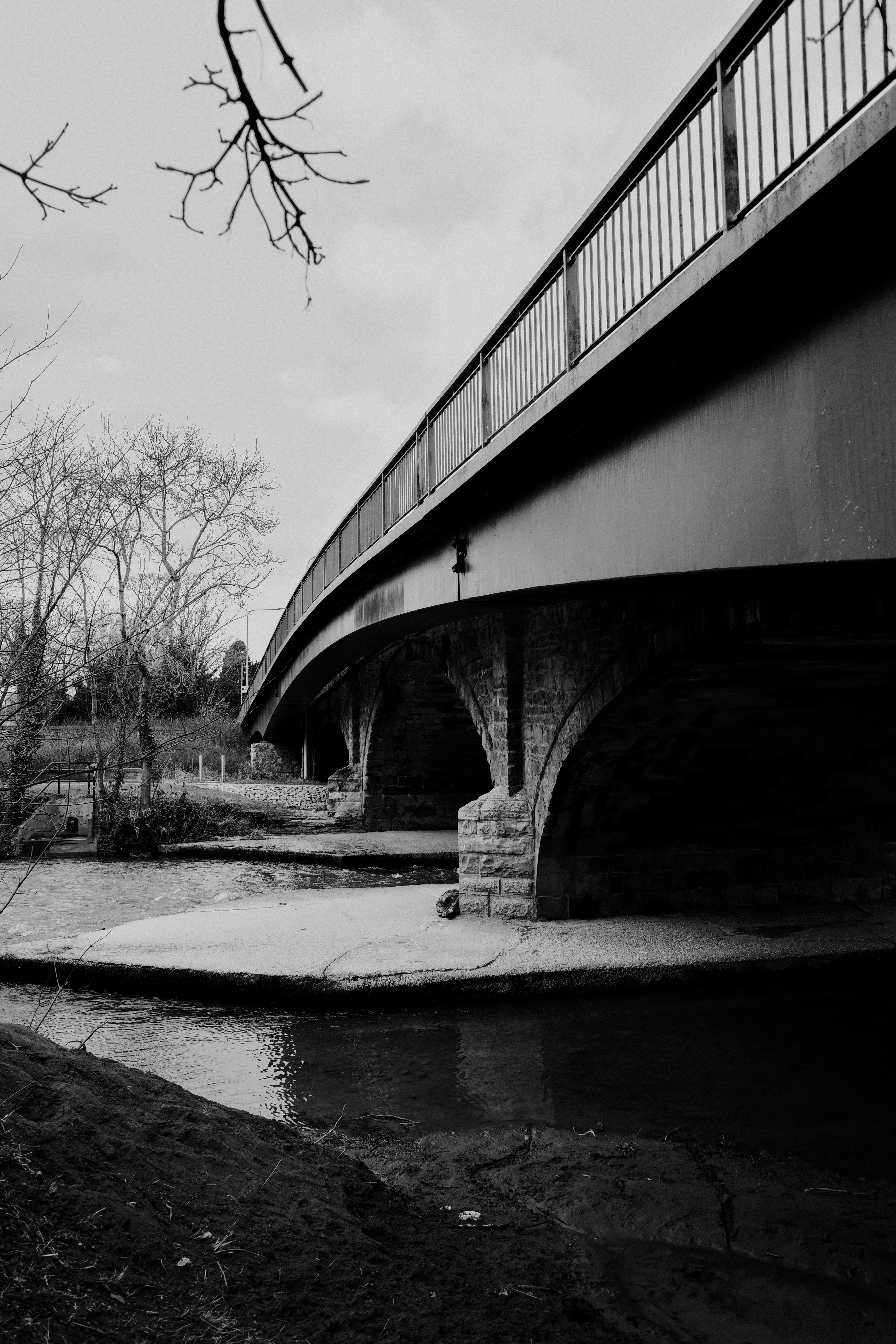 Black and White Bridge over Calm River · Free Stock Photo