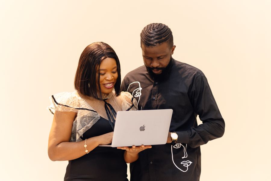 Colleagues reviewing research and data in a Lagos office