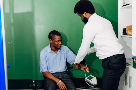 A doctor performs a blood pressure check in a Lagos clinic, emphasizing healthcare.