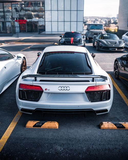 Free High-end sports cars parked outside a modern Ankara shopping center, showcasing luxury automotive design. Stock Photo