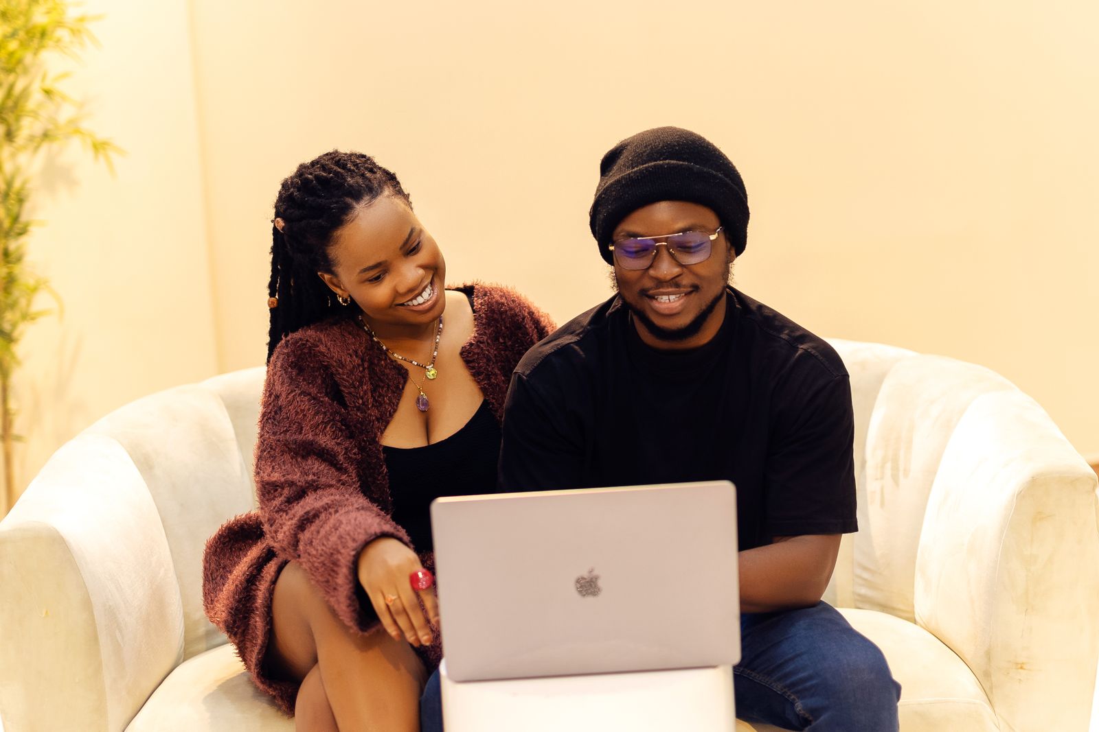 African couple relaxing in a comfortable modern home interior