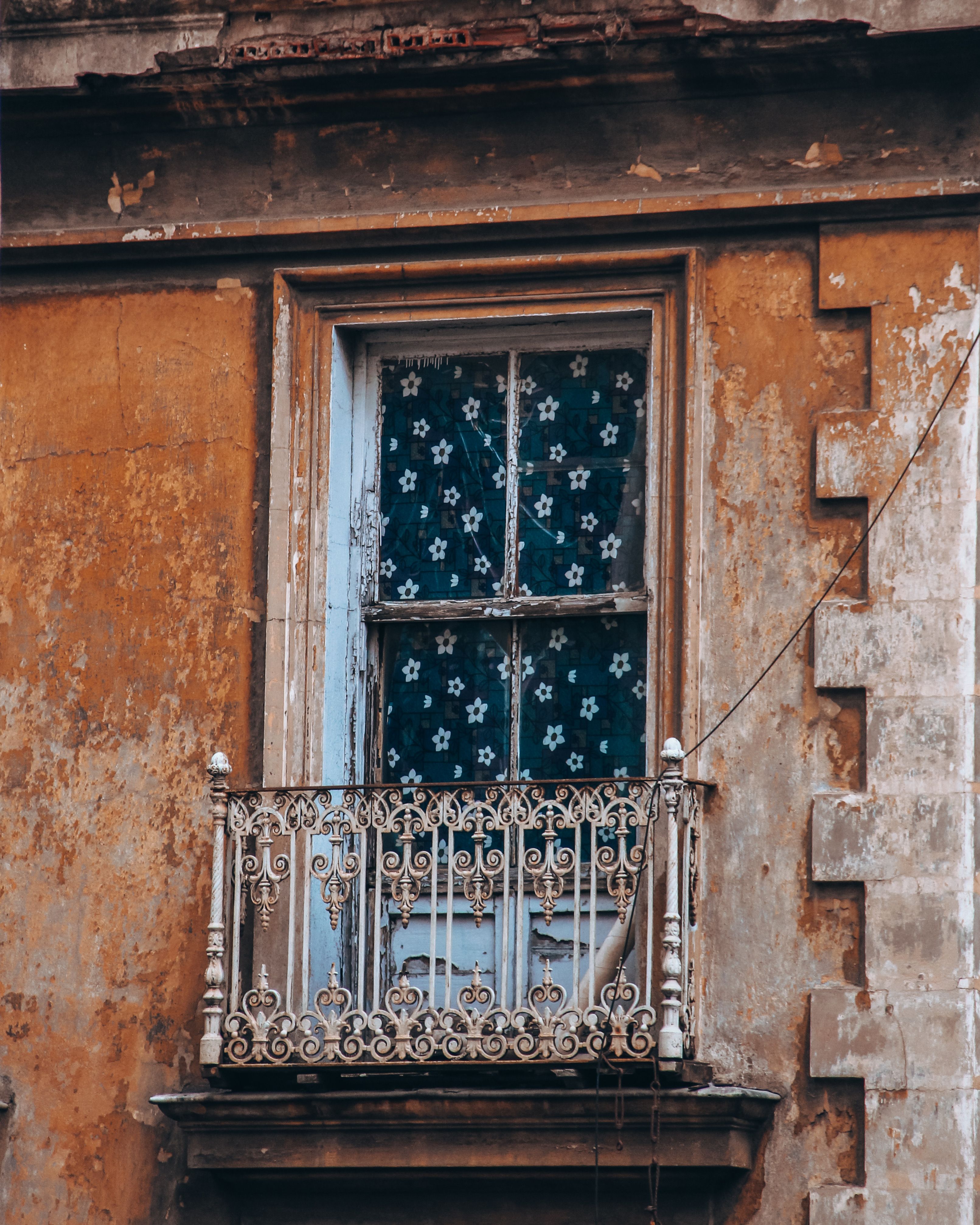 Weathered Window with Ornate Iron Railing · Free Stock Photo