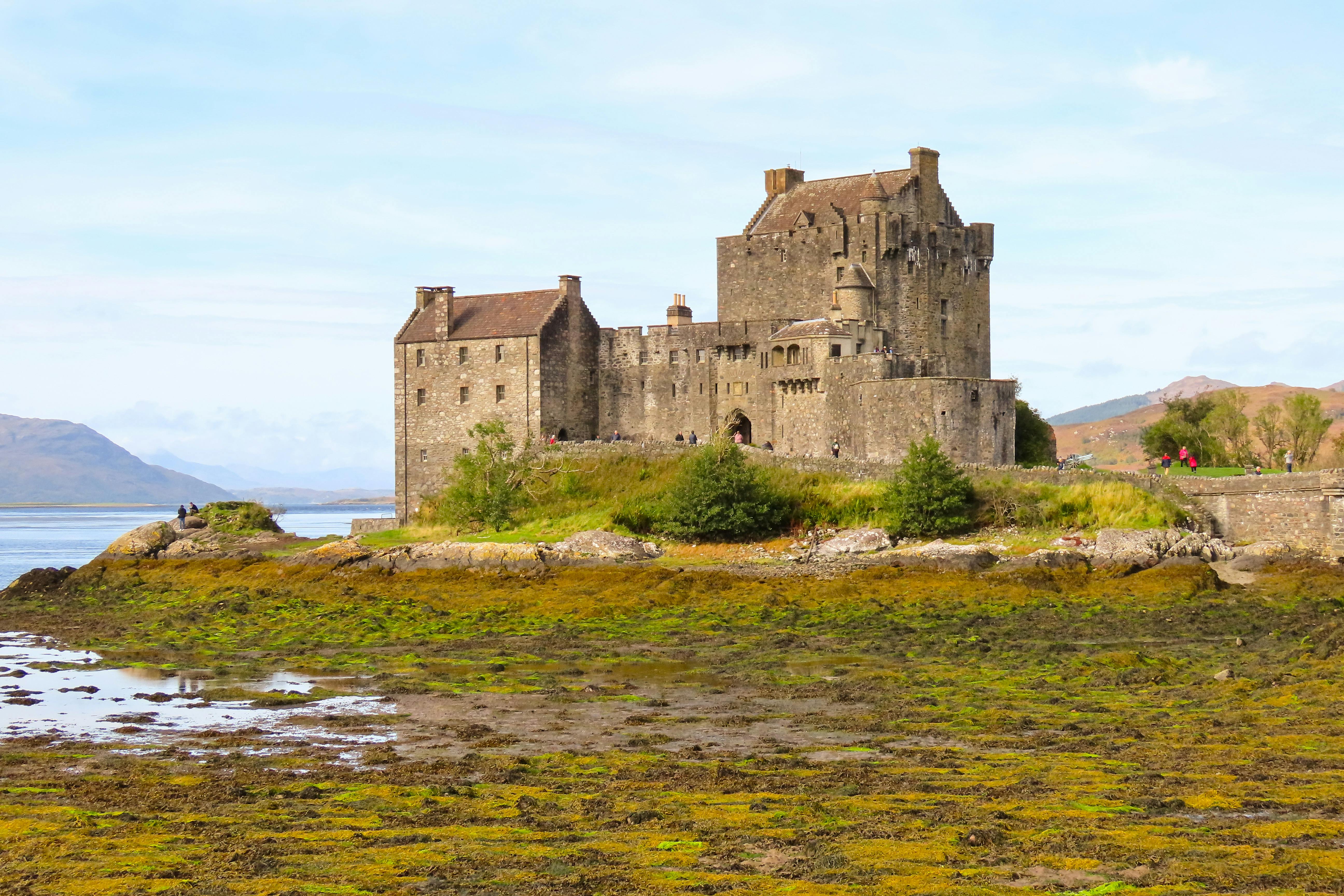 Eilean Donan Castle surrounded by stunning Scottish scenery, a perfect travel destination.