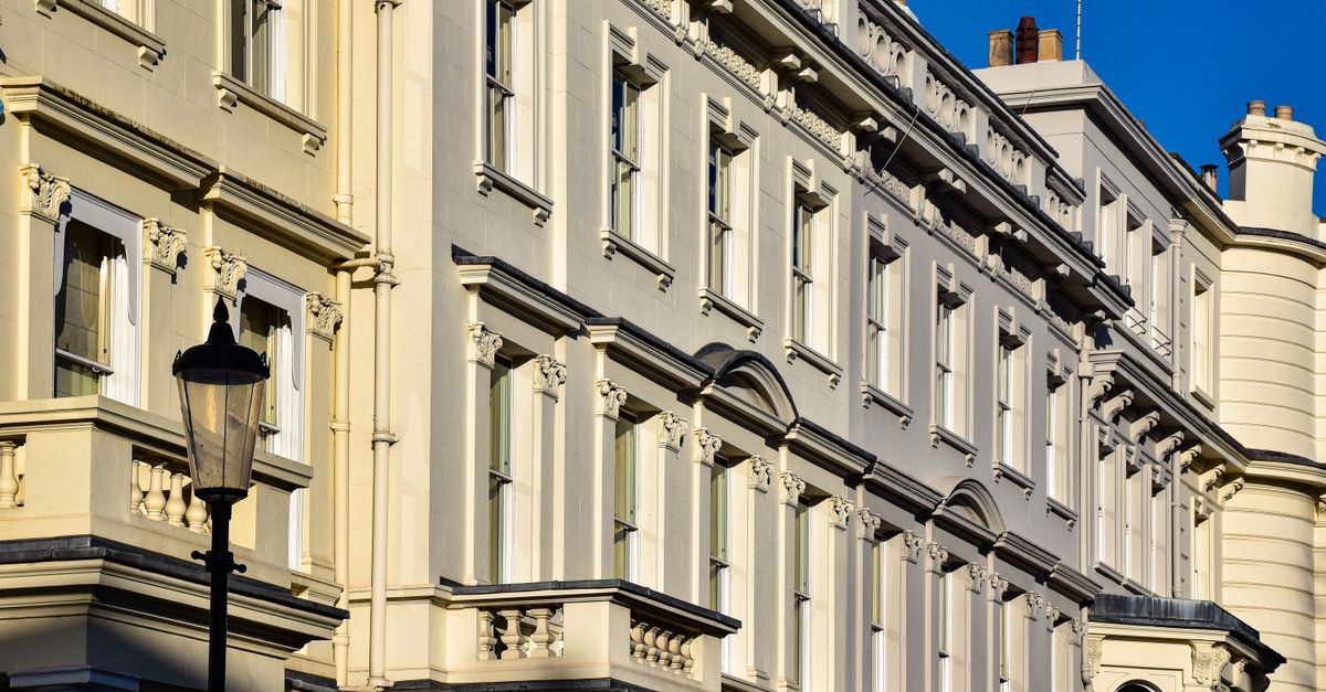 A beautiful example of Victorian architecture in a sunlit London street.