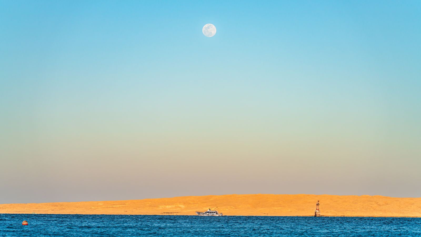 Tranquil red sea view with moon in hurghada, Egypt
