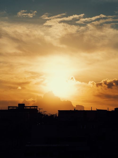 Free Silhouette of São Paulo skyline against a dramatic golden sunset. Stock Photo