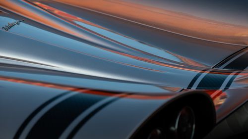 Free Detail shot of a luxurious silver hypercar with elegant curves and streamlined design. Stock Photo