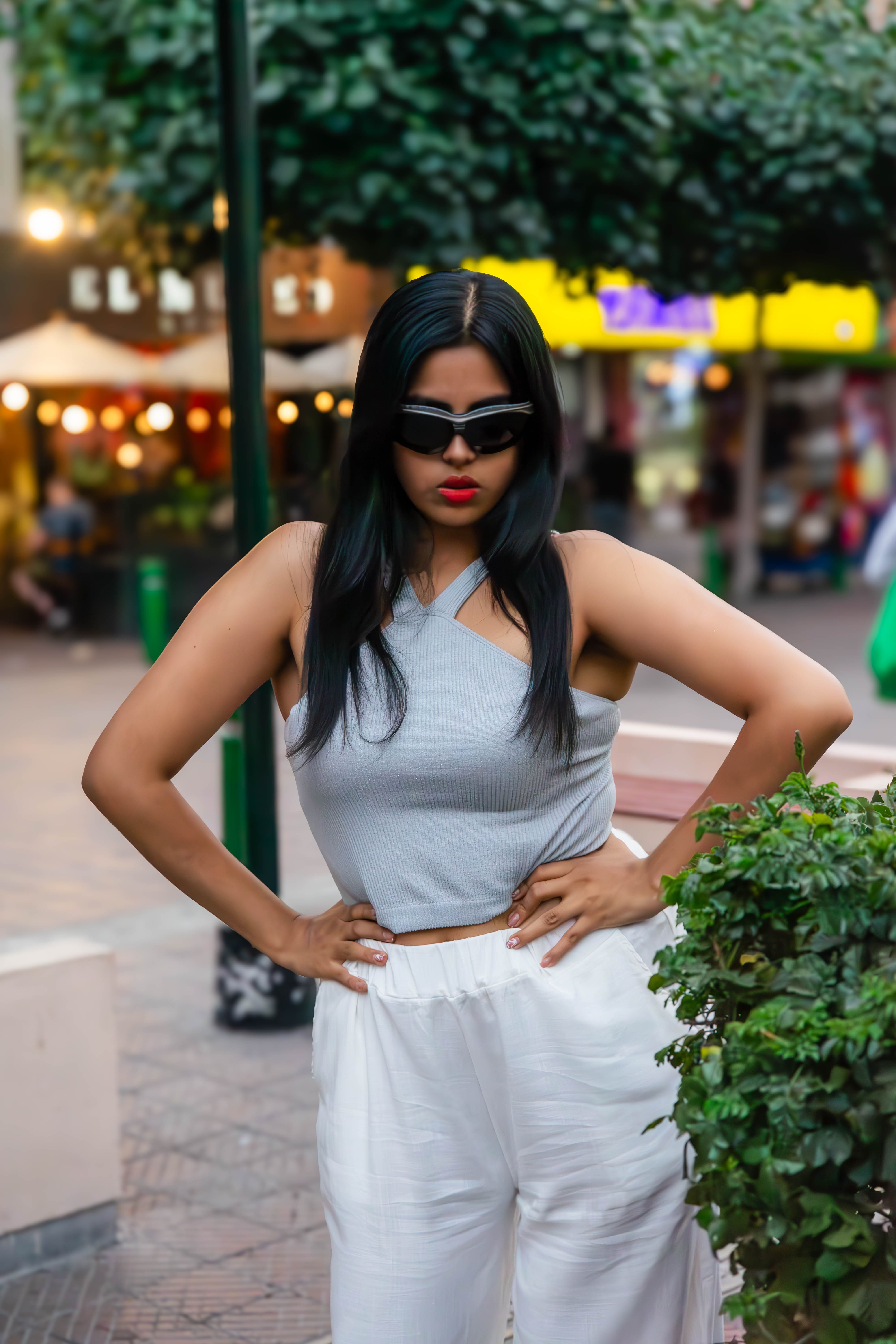 Stylish Woman Posing Outdoors in Urban Setting · Free Stock Photo