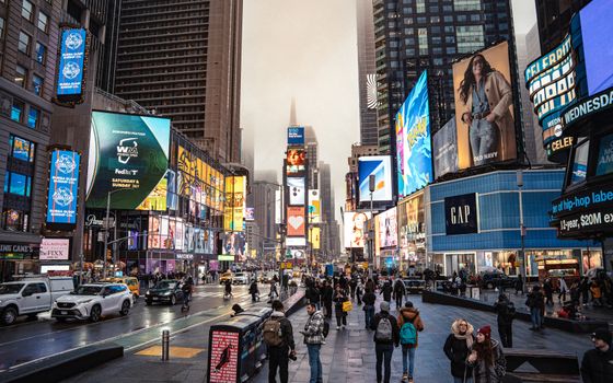 Bustling Times Square in New York City, featuring vivid billboards and lively urban life.