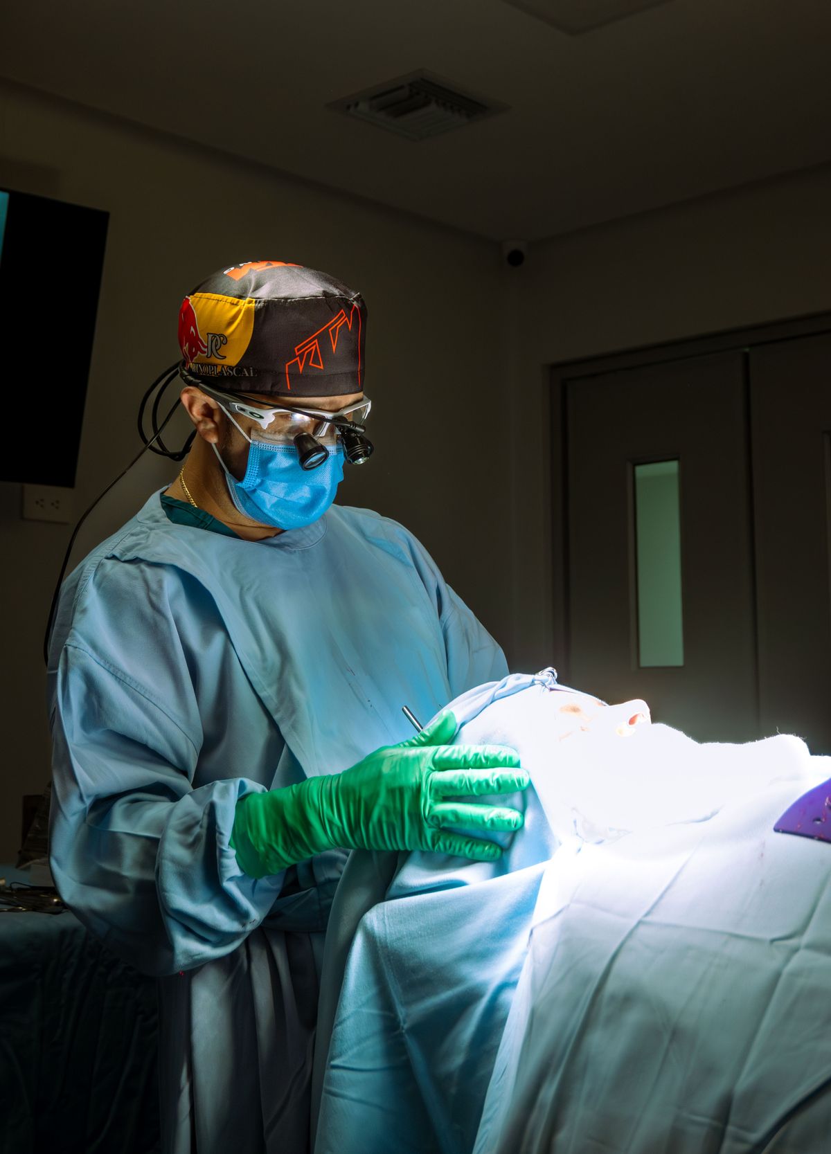 Surgeon working with precision during a rhinoplasty procedure in a sterile operating room
