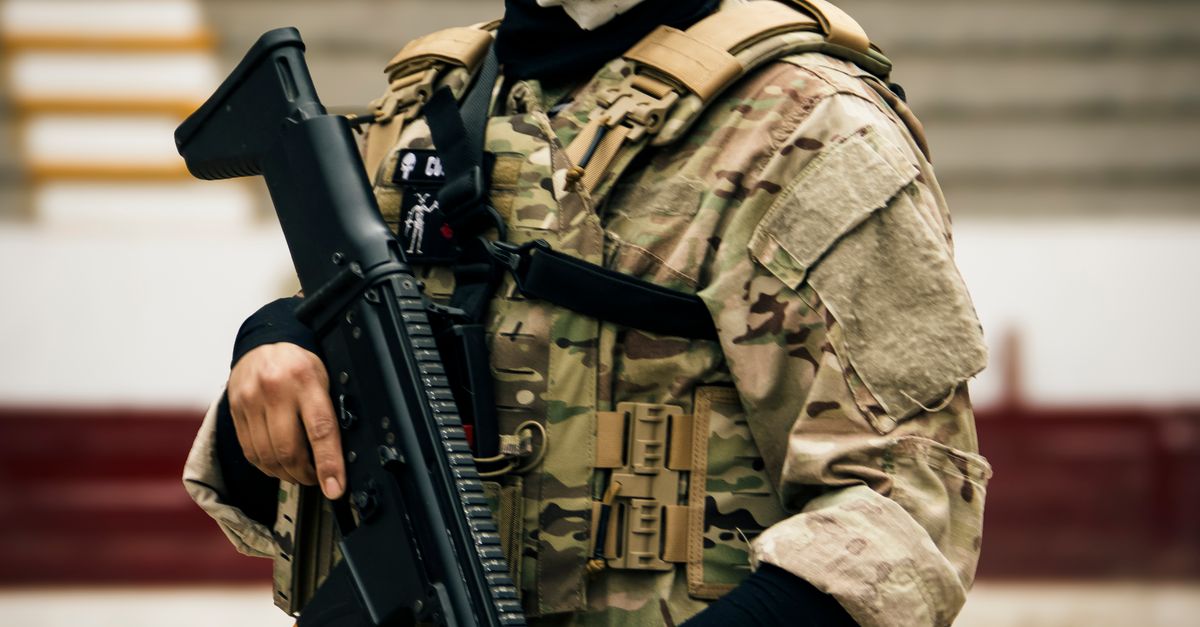 Tactical Rifle Crop Camouflaged Soldier with Tactical Gear and Rifle · Free Stock Photo