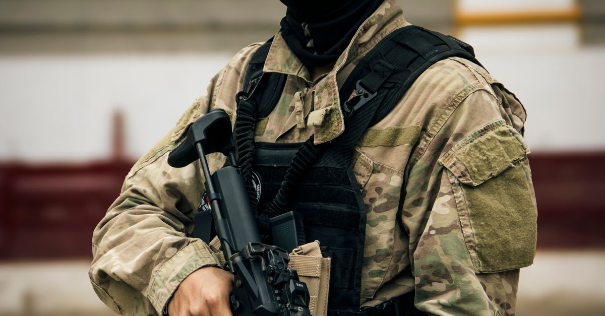 Tactical Rifle Crop Tactical Soldier in Camo Gear Holding Rifle · Free Stock Photo