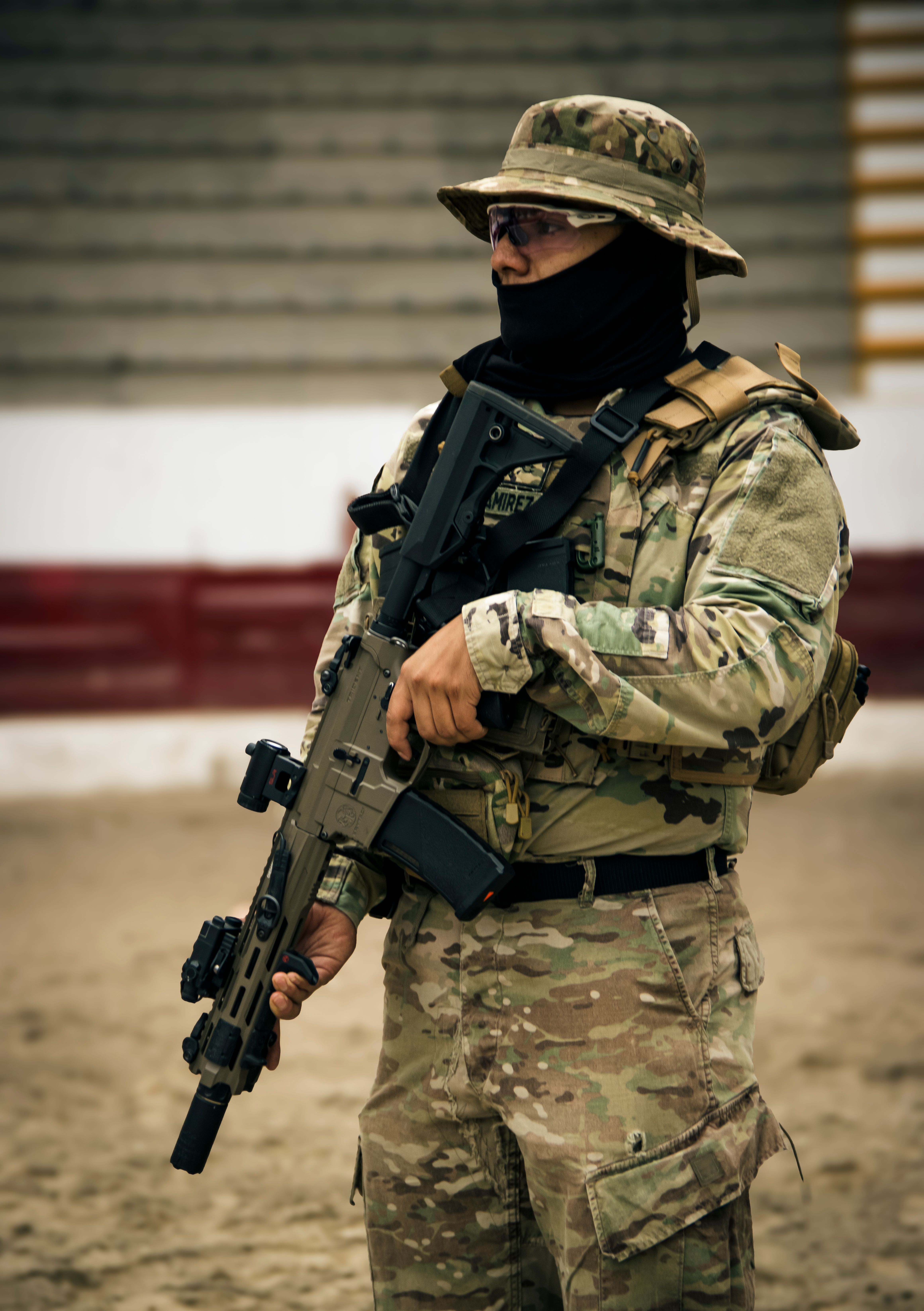 Military Soldier in Tactical Gear Holding Rifle · Free Stock Photo