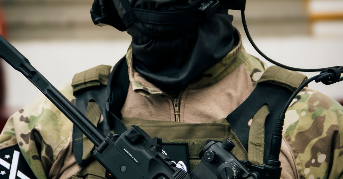 Tactical Rifle Crop Tactical Soldier in Camouflage Gear with Assault Rifle · Free Stock Photo