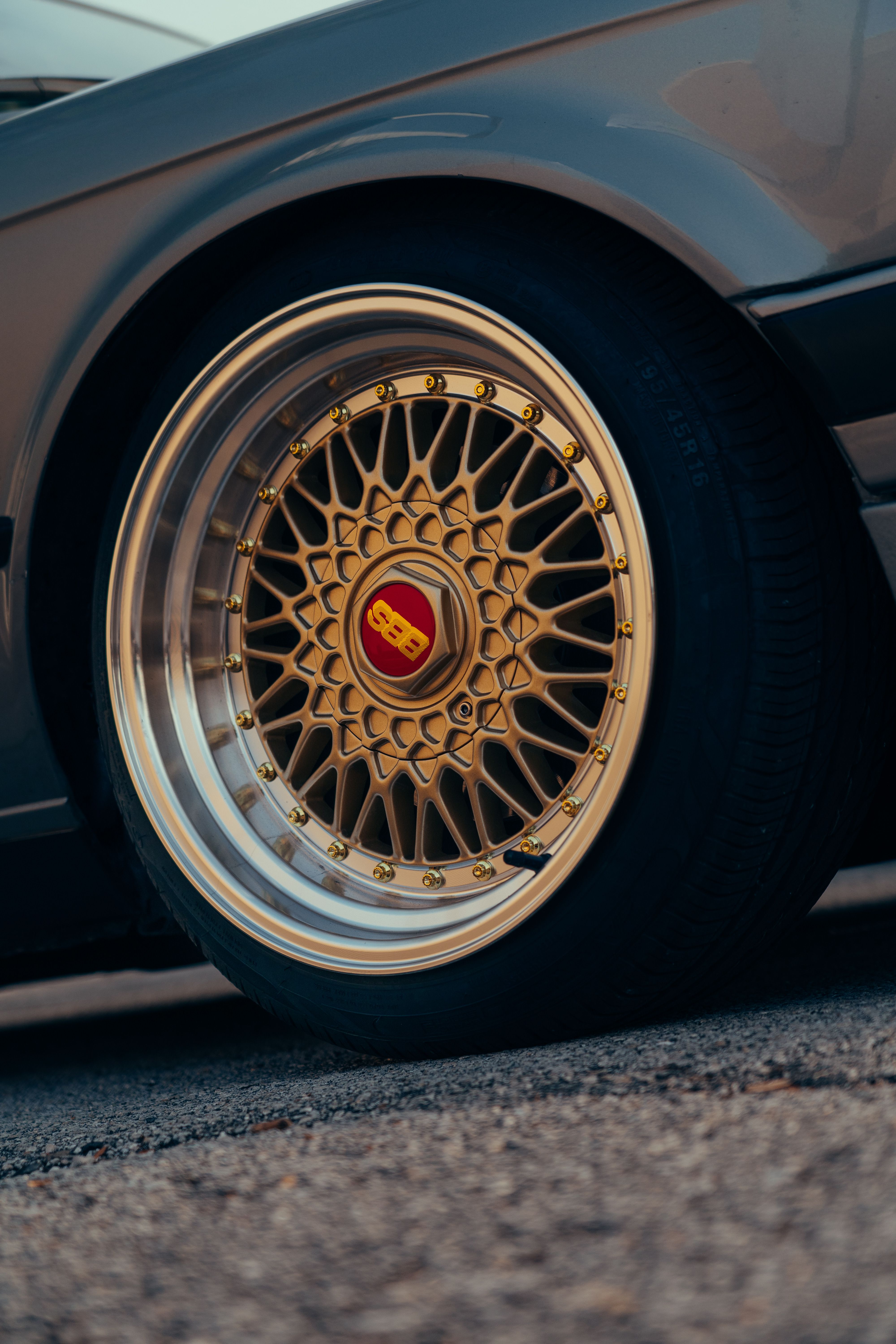 Close-up of Vintage Car with Golden Alloy Wheel · Free Stock Photo
