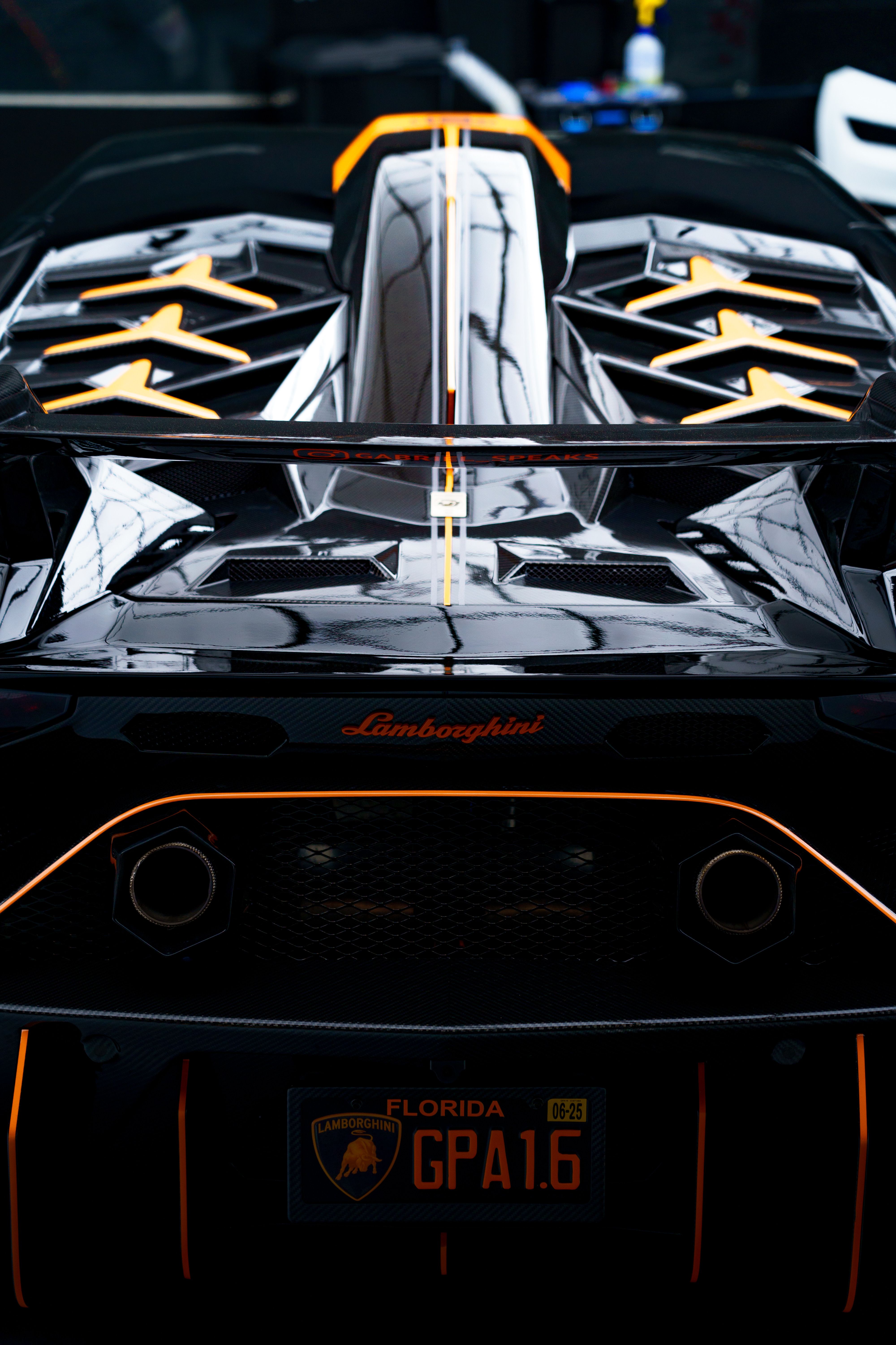 Sleek Black Lamborghini with Distinctive Tail Lights · Free Stock Photo