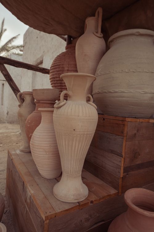 Free A rustic display of ancient clay pots arranged outdoors, showcasing traditional pottery. Stock Photo
