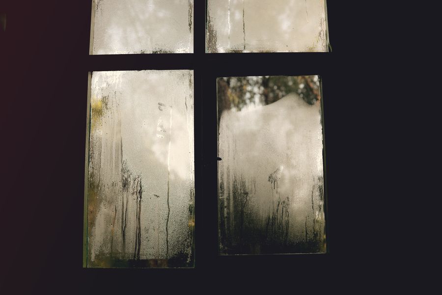 Stock photograph of a hazy window with condensation