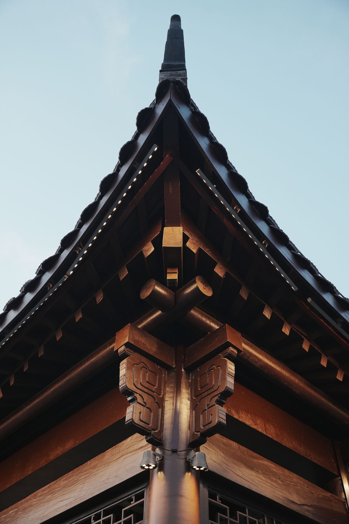 Close-up of traditional Japanese temple roof architecture with intricate wooden craftsmanship