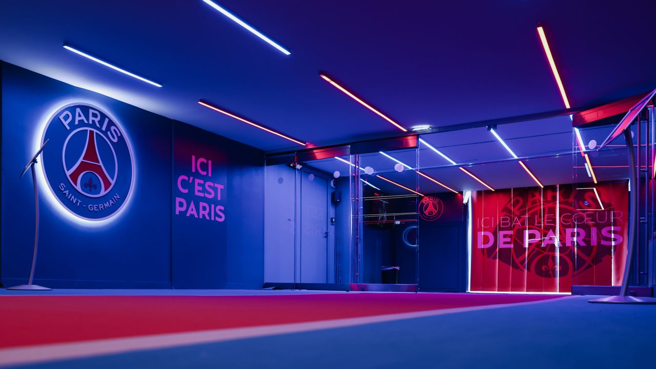 spacious psg entrance hallway in paris with striking neon lighting and