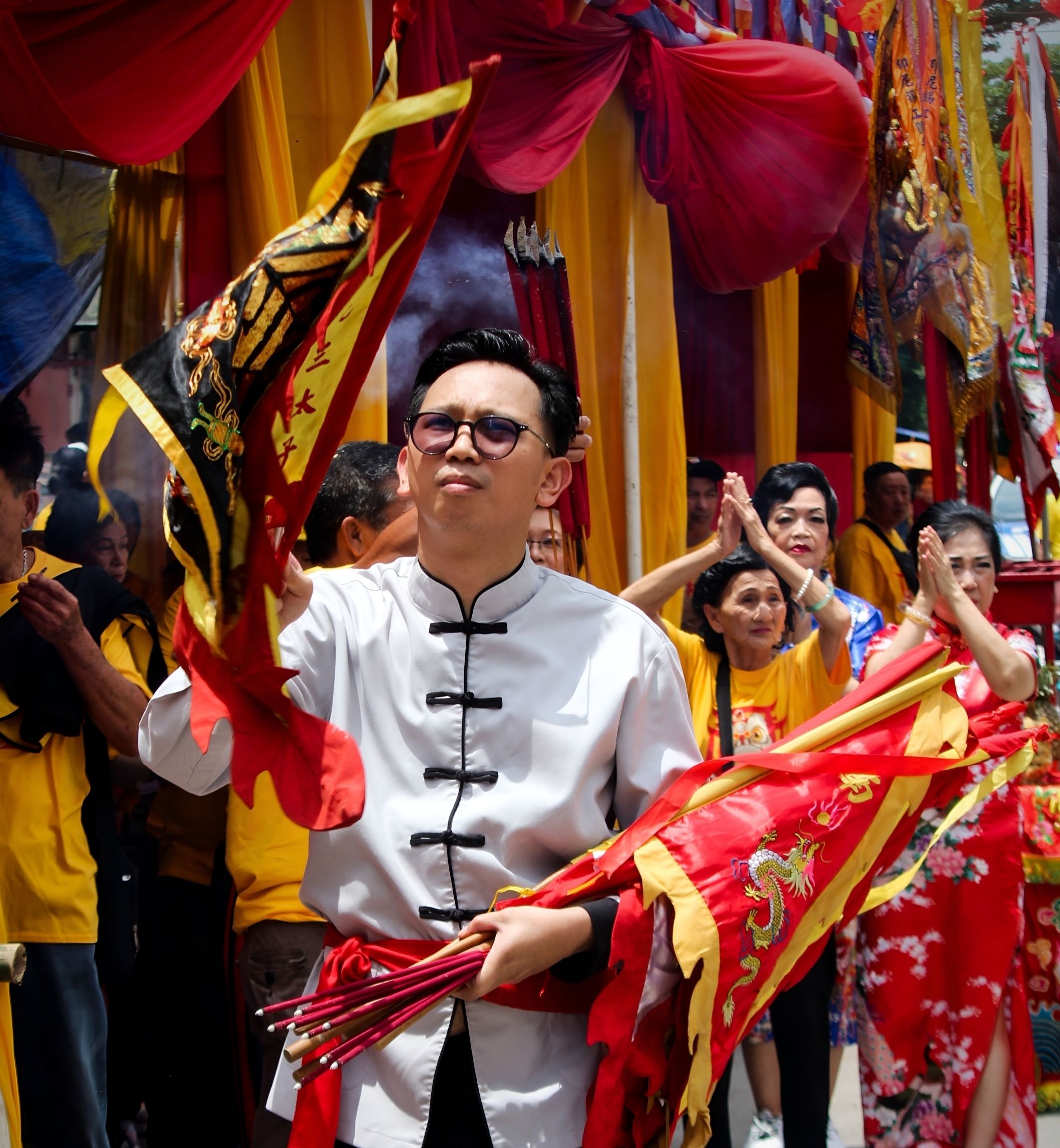 Vibrant traditional festival in Makassar with cultural attire and flags, capturing regional heritage.