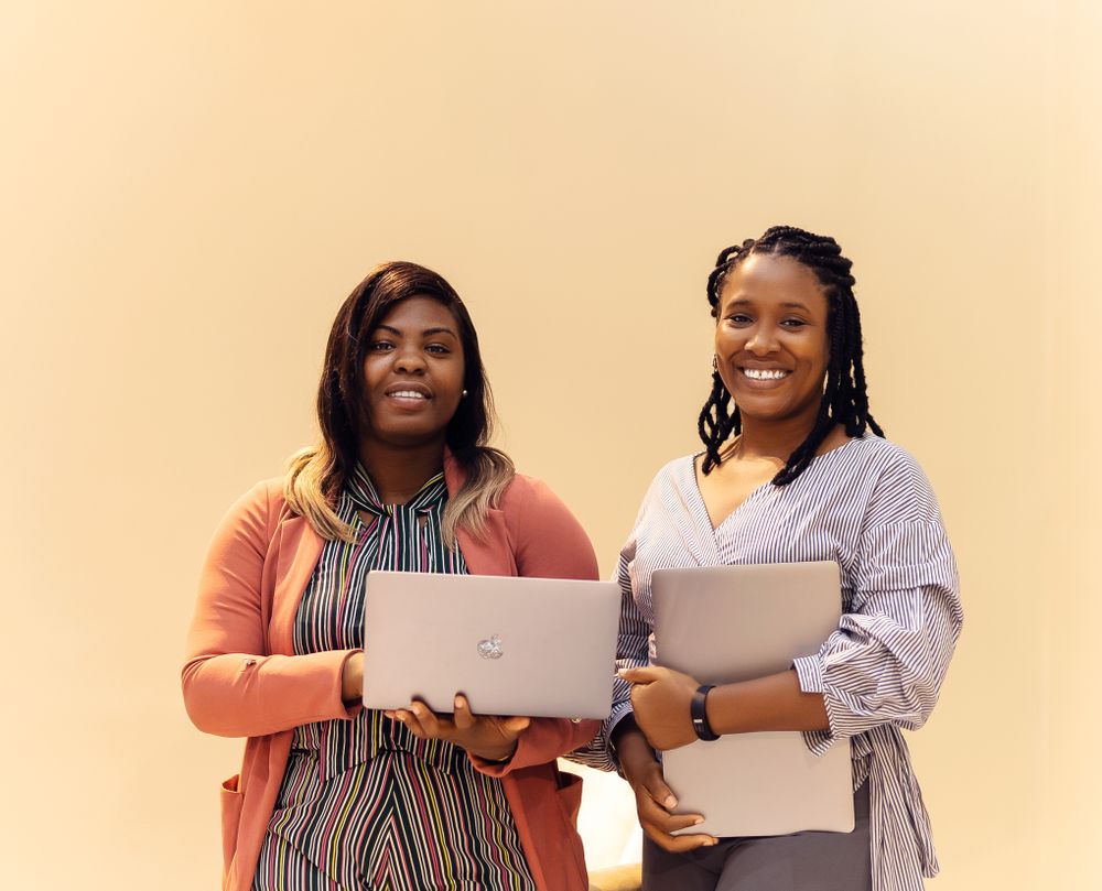 African professionals consulting and reviewing work together