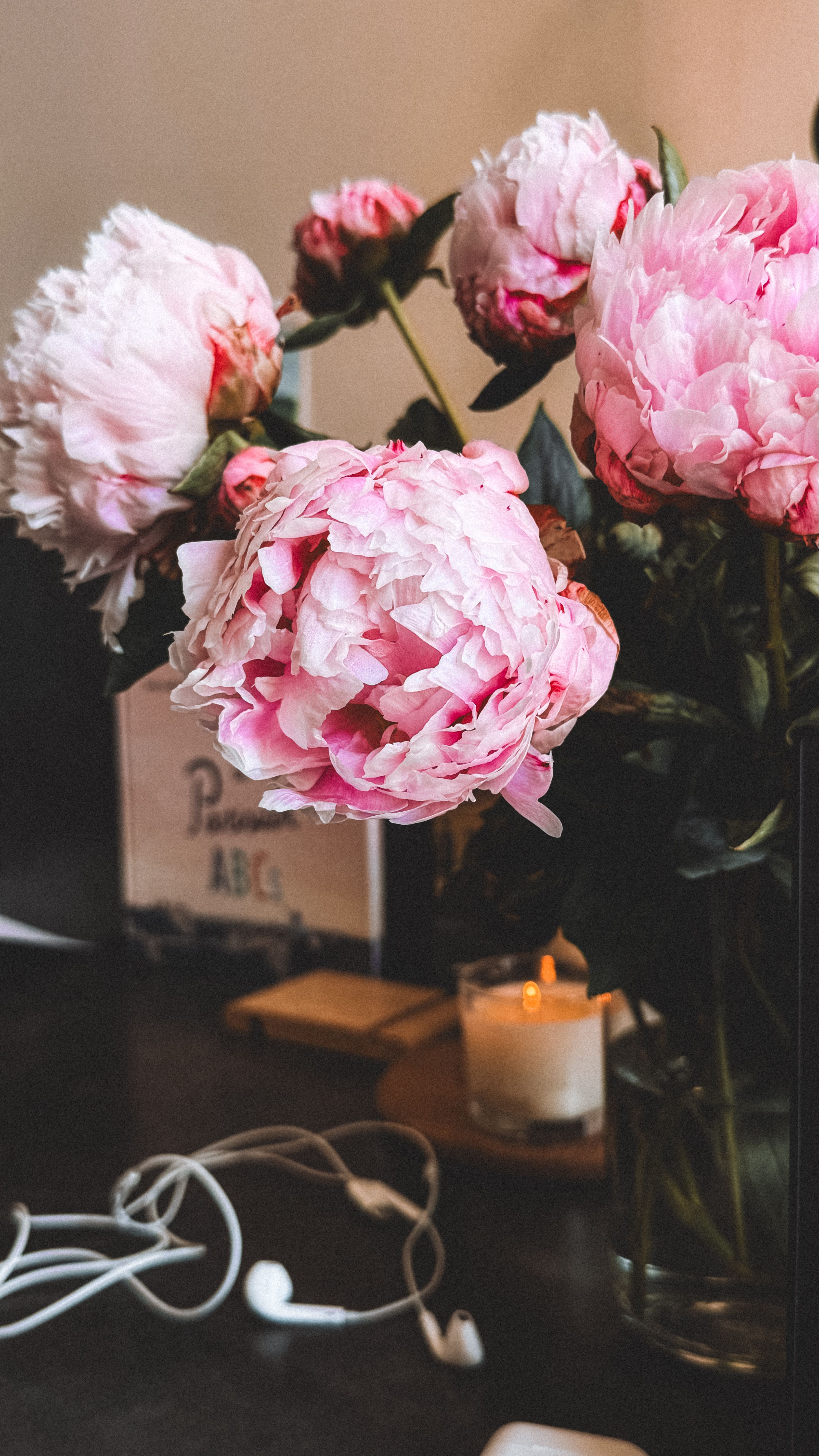 Kate  Filatova - A charming display of pink peonies and candlelight, perfect for cozy interiors.