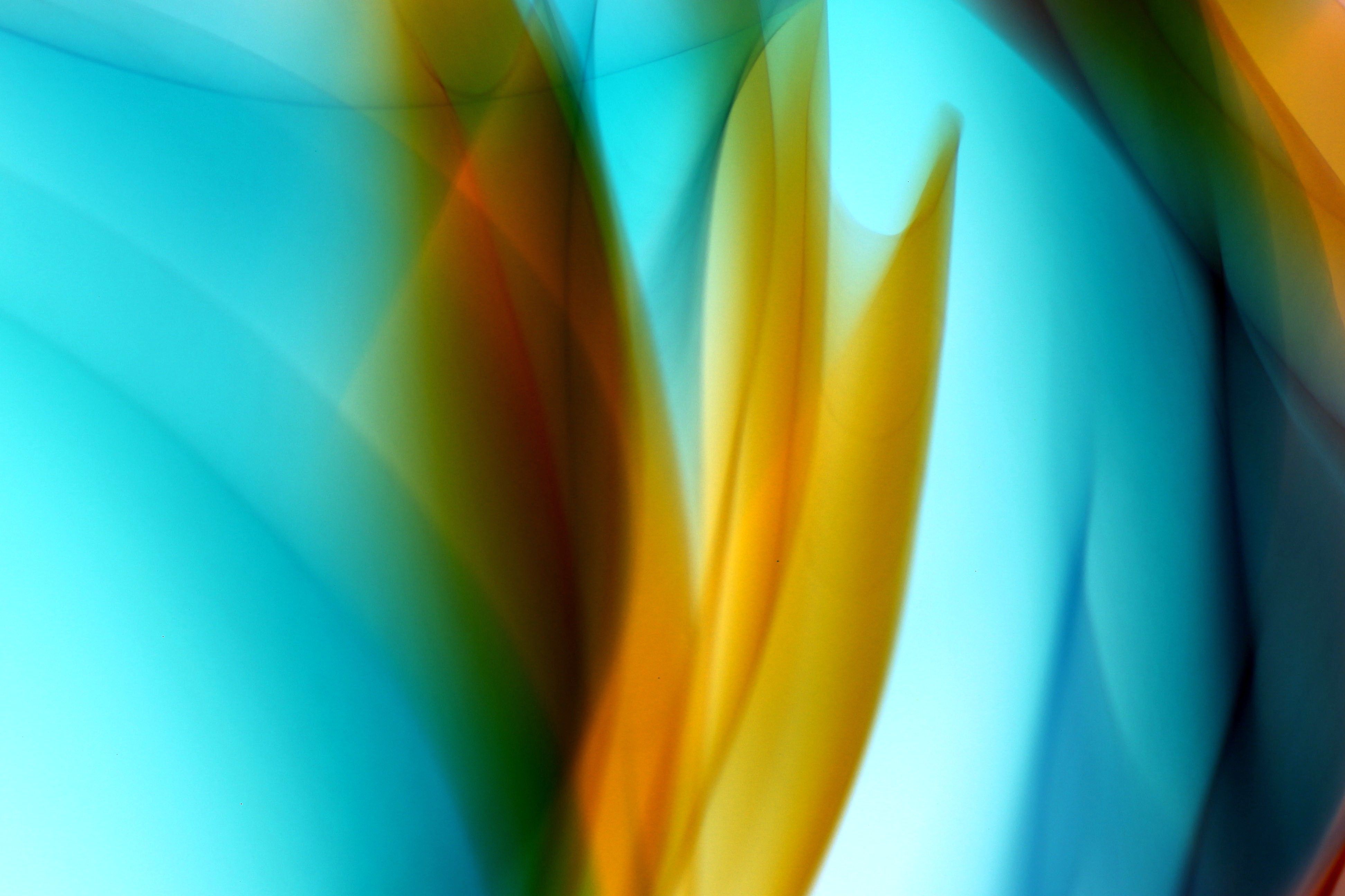 Colorful abstract artwork showcasing dynamic blue and orange swirls creating a vibrant visual effect.