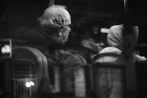 Free Black and white photo capturing passengers inside a bus in Elche, Spain. Stock Photo