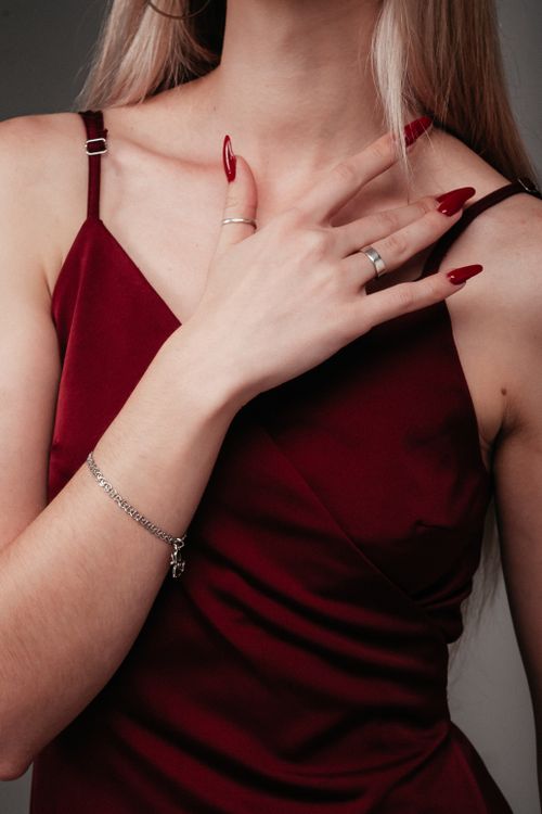 Elegant Woman in Burgundy Dress with Jewelry  Free Stock Photo