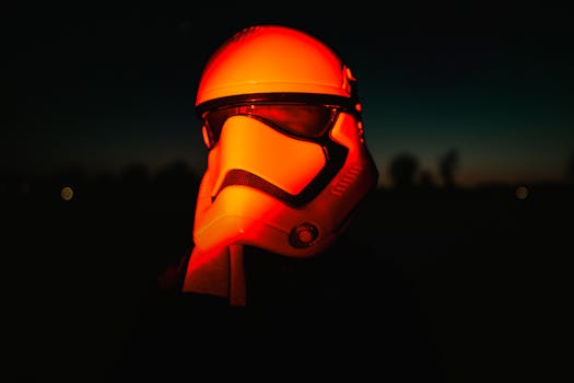 Moody night shot of a sci-fi helmet illuminated by red light, evoking a cinematic feel.