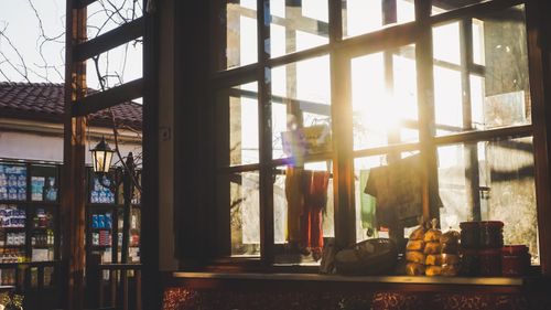 Free Sunlight streaming through a rustic village window on a winter day. Stock Photo
