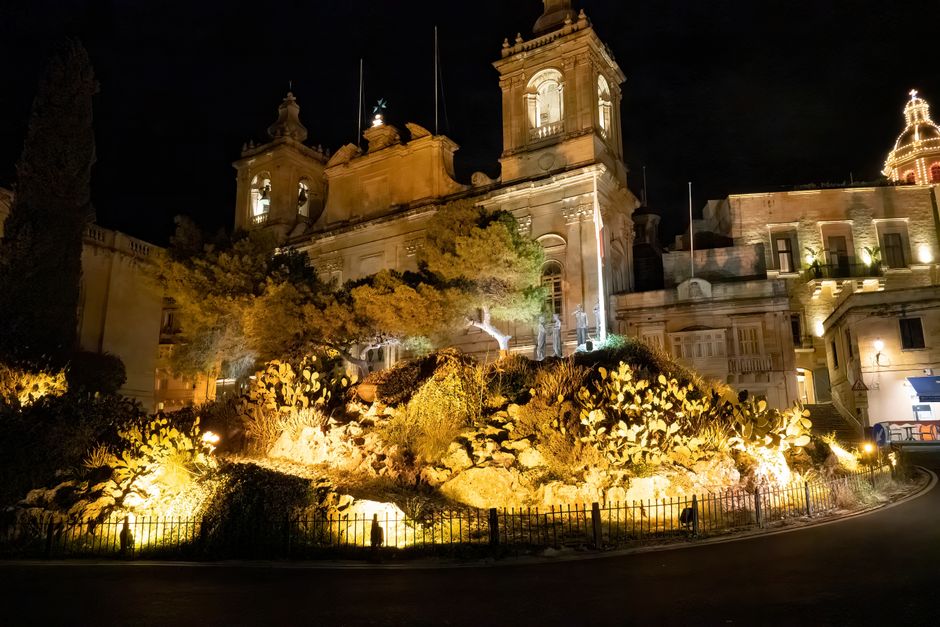 The ancient walled city of Mdina, Malta, at sunset, with golden light illuminating its narrow, quiet streets.