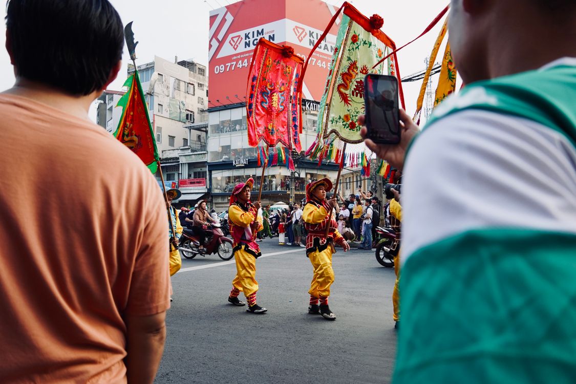 Structured Parade Colorful street parade with performers and flags · Free Stock Photo