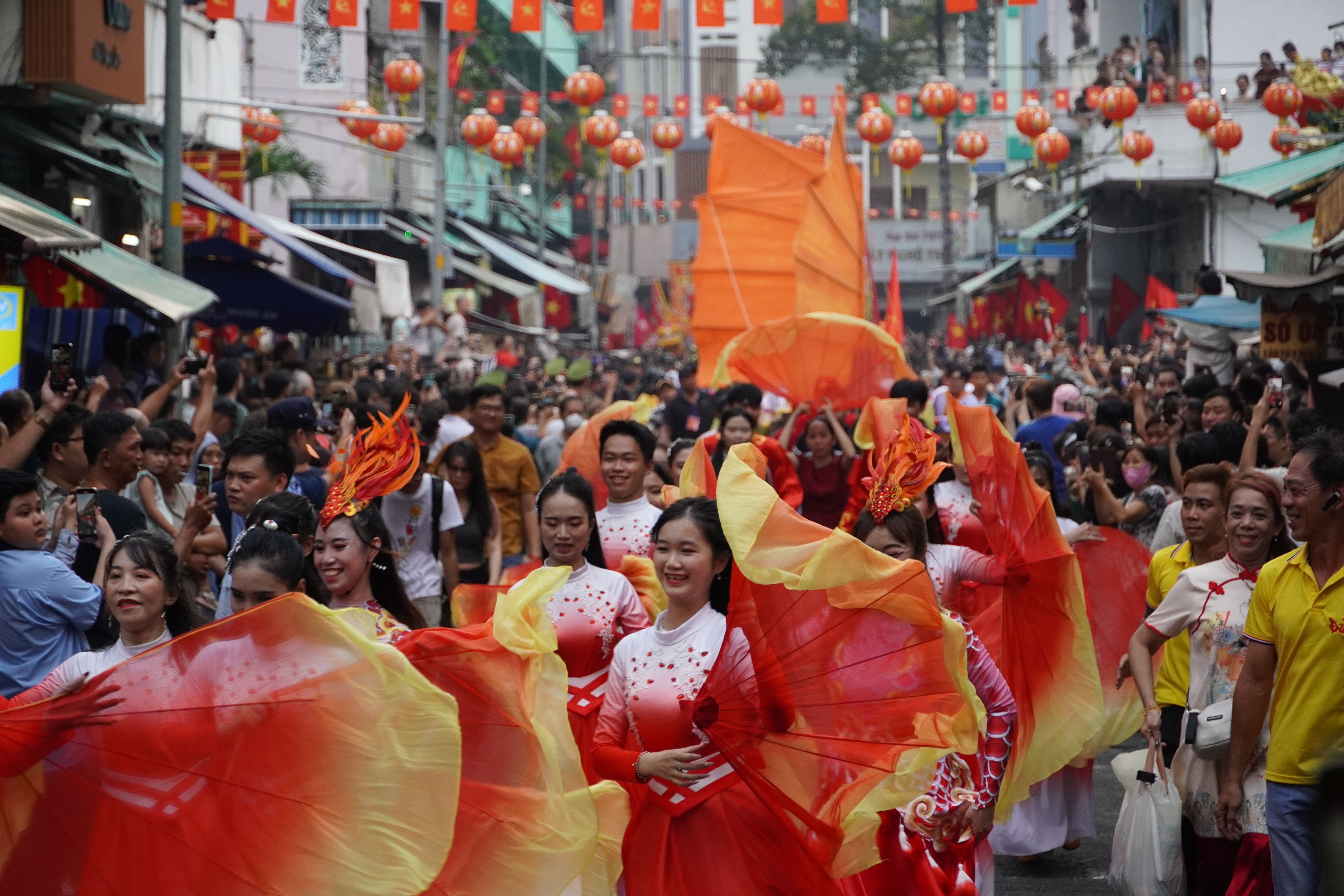Vibrant Festival Parade with Traditional Dancers · Free Stock Photo