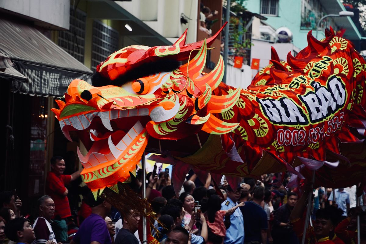 Vibrant traditional dragon parade celebration with colourful costumes